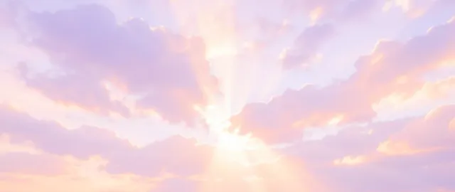 Dreamy dawn cloudscape with soft pastel clouds in pink, lavender, and peach and gentle sun rays