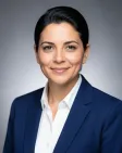 Executive corporate headshot with neutral studio backdrop and professional soft lighting