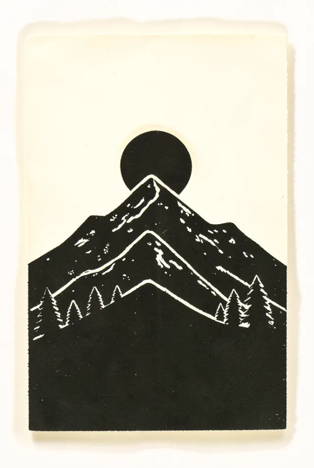 Single-colour linocut print of layered mountain ridges with carved white gouge marks on cream paper