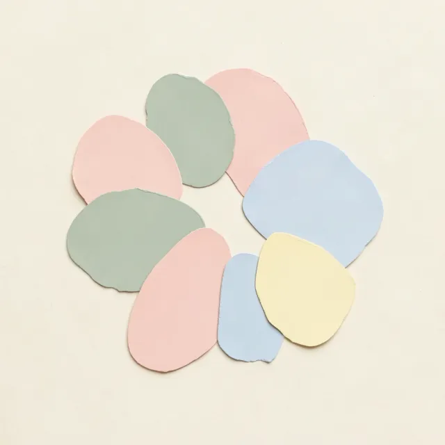 A pastel color-block composition of organic cut-out shapes