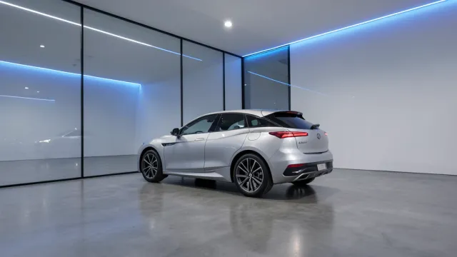Sleek silver electric car in minimalist showroom with polished concrete and glass wall