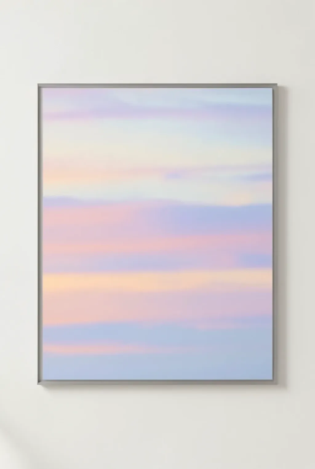 Soft abstract sunset sky with blended peach, lavender, and pale blue twilight cloud bands