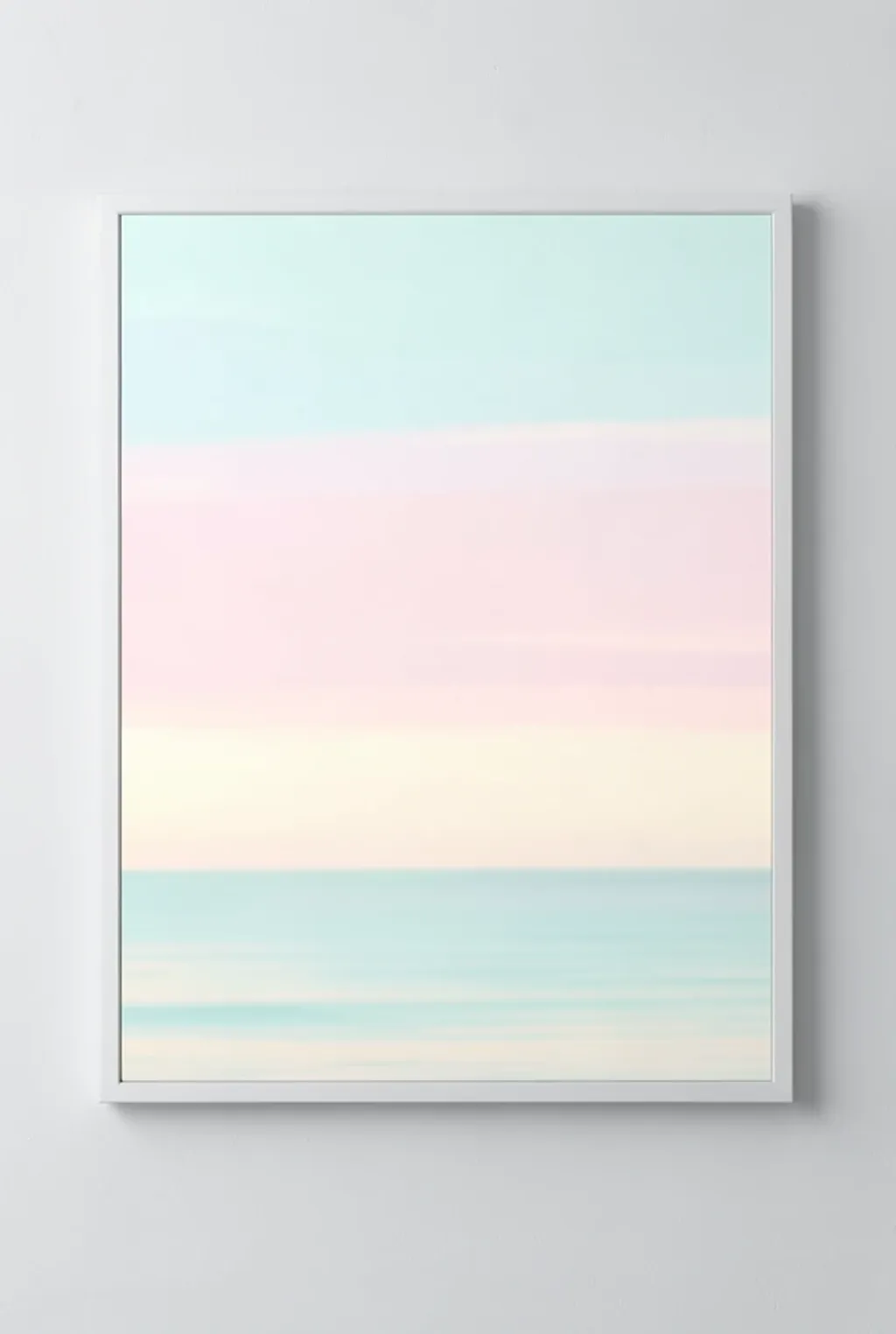 Soft pastel ocean sky with blended aqua, pink, and cream horizontal bands suggesting calm sky over water