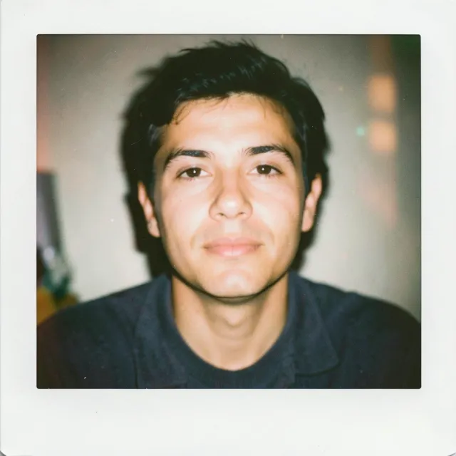 Candid vintage instant-film portrait with soft washed colors, gentle flash and subtle grain